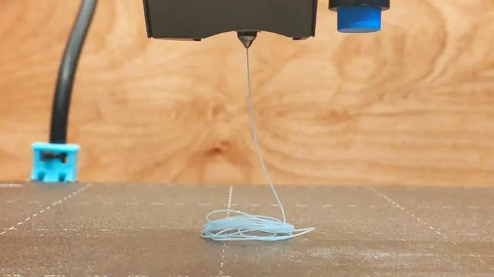 Removing extra filament from underneath the nozzle